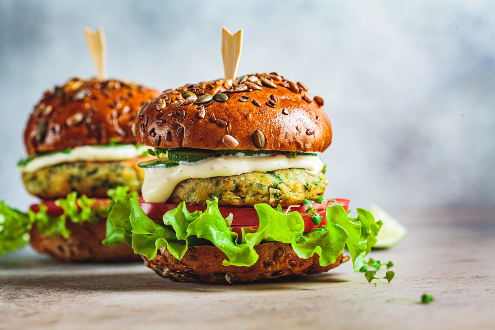 Falafel Burgers with Pickled Onion, Red Cabbage, Cucumber Ribbons, Sriracha & Herb Yoghurt