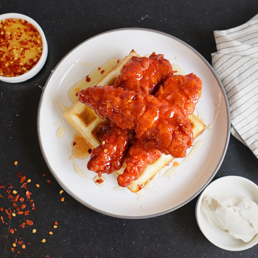 Hot Chicken Tenders with Cajun Waffles and Hot Honey