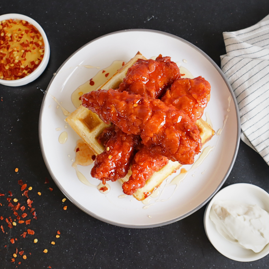 Spicy Chicken Tenders with Cajun Waffles and Hot Honey