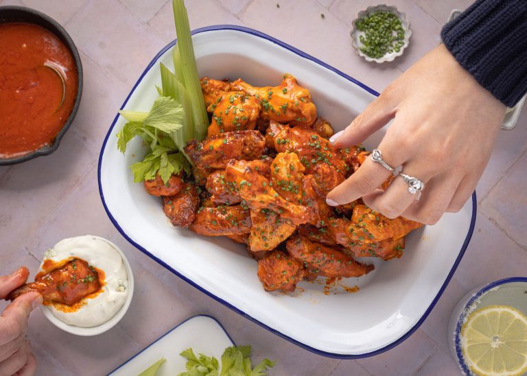 Crispy chicken wings in a buffalo hot sauce with blue cheese dressing.